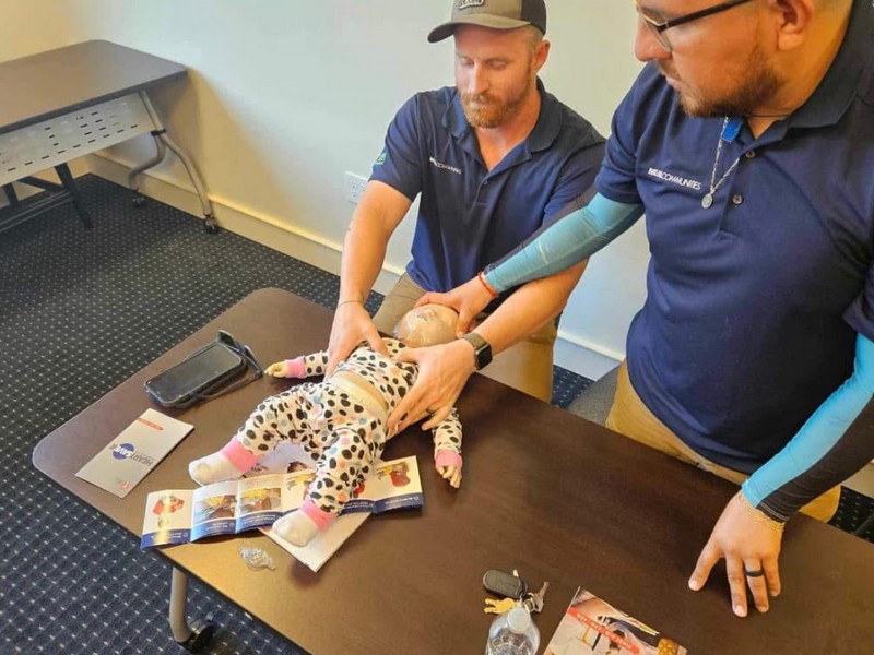 Practicing CPR for an infant